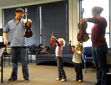 Bethy playing violin with Sarah